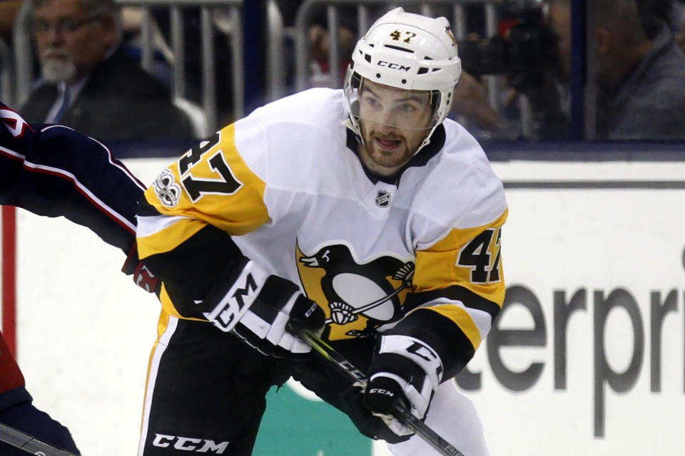 FILE - Pittsburgh Penguins forward Adam Johnson in action during an NHL hockey game in Columbus, Ohio, Friday, Sept. 22, 2017. "Import” hockey players in the United Kingdom don't earn big salaries but the lifestyle and perks are pretty good. They get free use of a car and rent-free housing. These mostly Canadian and American imports are mini-celebrities around the Elite Ice Hockey League. They can also earn a master's degree tuition-free. Adam Johnson of the Nottingham Panthers was living with his fiancée and studying at a business school. (AP Photo/Paul Vernon, file)