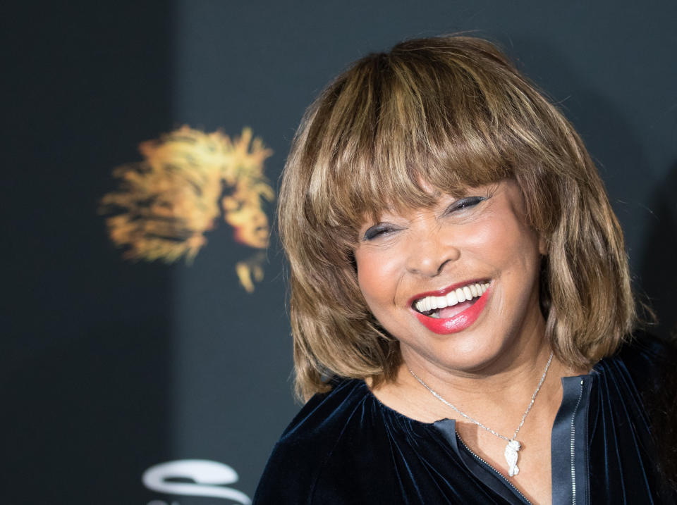 Tina Turner smiles while attending a photo shoot for "Tina - The Tina Turner Musical" in 2018