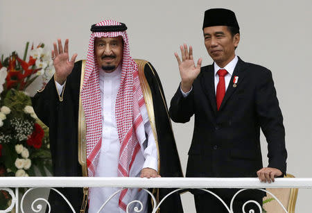 Saudi King Salman, left, and Indonesian President Joko Widodo wave to the media during their meeting at the presidential palace in Bogor, West Java, Indonesia, Wednesday, March 1, 2017. Salman arrived in the world's largest Muslim nation on Wednesday as part of a multi-nation tour aimed at boosting economic ties with Asia. REUTERS/Achmad Ibrahim