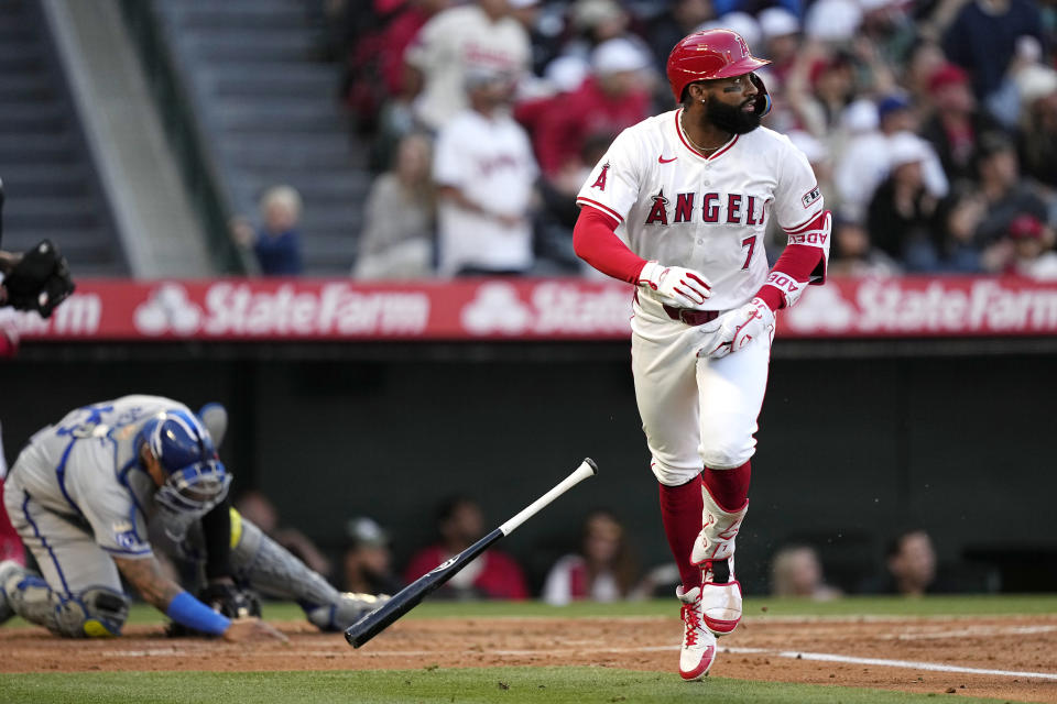 Los Angeles Angels' Jo Adell, right, heads to first after hitting a three-run home run while Kansas City Royals catcher Salvador Perez kneels at the plate during the second inning of a baseball game Saturday, May 11, 2024, in Anaheim, Calif. (AP Photo/Mark J. Terrill)