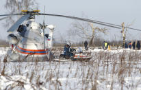 <p>Russian Emergency Situations Ministry employees and Russian police officers work at the scene of a AN-148 plane crash in Stepanovskoye village, about 40 kilometers (25 miles) from the Domodedovo airport, Russia, Feb. 12, 2018. (Photo: Alexander Zemlianichenko/AP) </p>