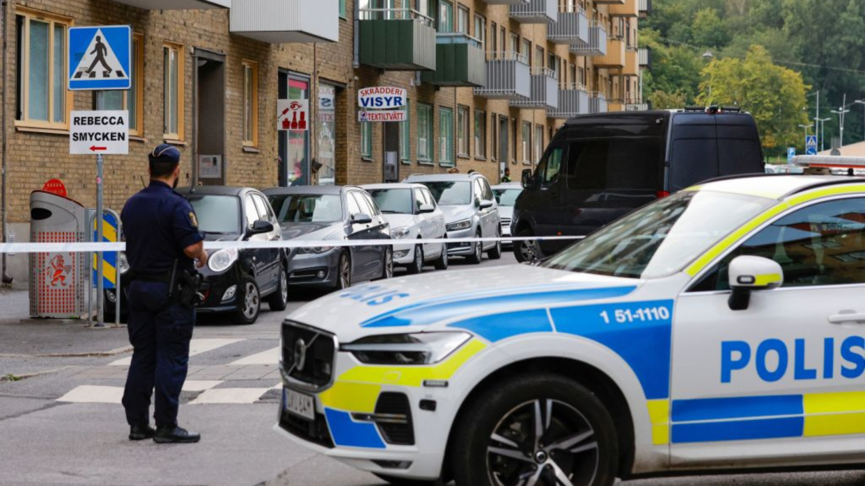  A street is barricaded by a police car in Sweden. 