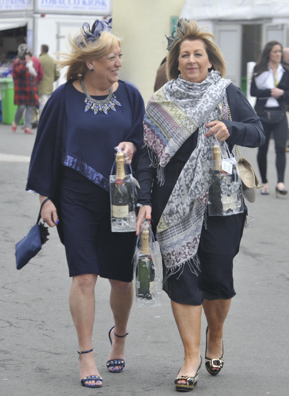 Matching navy and bold, jewelled accessories were on the menu for Day 1 for these two friends.