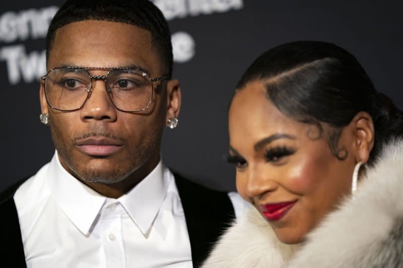 Ashanti (R) and Nelly are engaged and expecting their first child together. File Photo by Bonnie Cash/UPI.