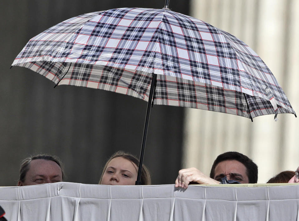 Swedish teenage environmental activist Greta Thunberg, second from right, attends Pope Francis' weekly general audience in St. Peter's Square, at the Vatican, Wednesday, April 17, 2019. (AP Photo/Alessandra Tarantino)