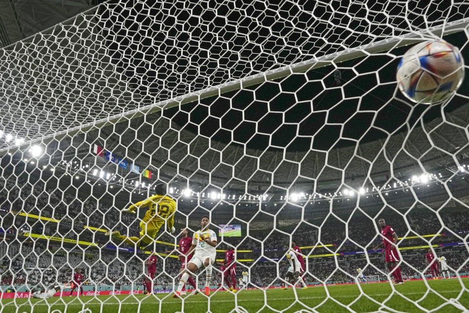 Senegal's Famara Diedhiou scores his side's second goal during the World Cup group A soccer match between Qatar and Senegal, at the Al Thumama Stadium in Doha, Qatar, Friday, Nov. 25, 2022. (AP Photo/Petr David Josek)