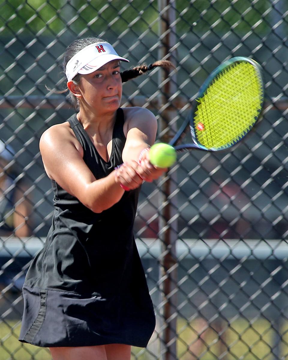 Hingham’s #1 Sanya Khadivi rips a backhand return to her opponent during her Round of 32 match against Shrewsbury in the Division 1 state tournament at Hingham High on Wednesday, May 31, 2023.