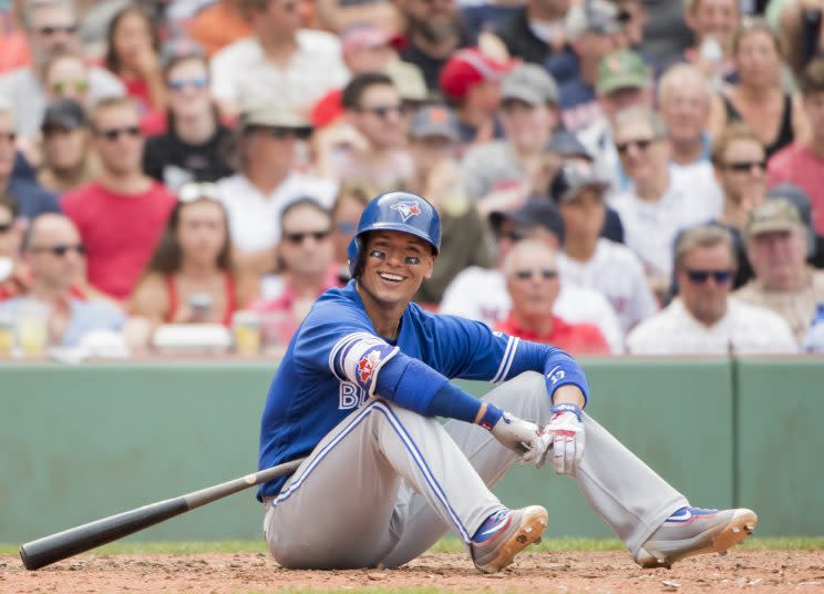 All Ryan Goins could do was smile after his unusual groundout. (Getty Images)