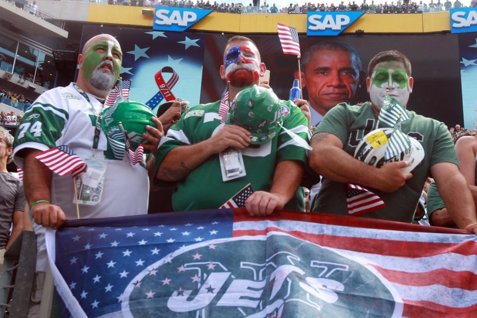 <p>Fans listen to a message from President Barack Obama before a game between the New York Jets and the Cincinnati Bengals at MetLife Stadium. Mandatory Credit: Brad Penner-USA TODAY Sports </p>