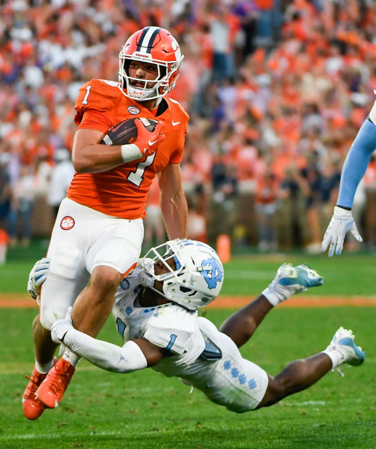 North Carolina wide receiver Andre Greene (1) tackles Clemson running back Will Shipley (1) on Nov 18, 2023; Clemson, South Carolina, USA; at Memorial Stadium.