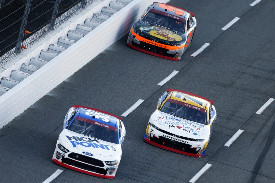 MARTINSVILLE, VIRGINIA - OCTOBER 31: Chase Briscoe, driver of the #98 HighPoint.com Ford, Justin Allgaier, driver of the #7 Unilever United For America Chevrolet, and Noah Gragson, driver of the #9 Bass Pro Shops/TrueTimber Camo Chevrolet, race during the NASCAR Xfinity Series Draft Top 250 at Martinsville Speedway on October 31, 2020 in Martinsville, Virginia. (Photo by Brian Lawdermilk/Getty Images)