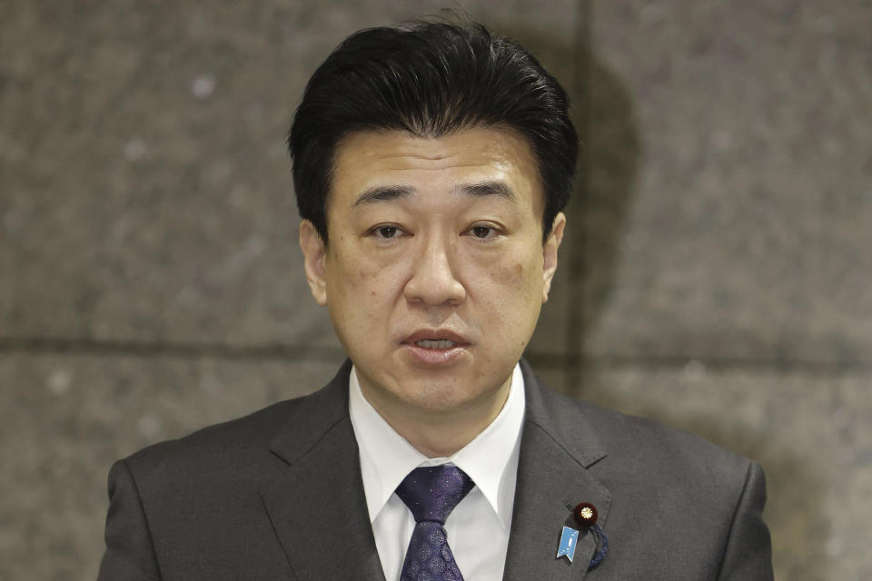 Japan's Defense Minister Minoru Kihara speaks to journalists at Defense Ministry in Tokyo early Sunday, April 21, 2024. Two Japanese navy helicopters carrying eight crew members crashed in the Pacific Ocean south of Tokyo during a nighttime training exercise after possibly colliding with each other, Japan’s defense minister said Sunday. (Kyodo News via AP)