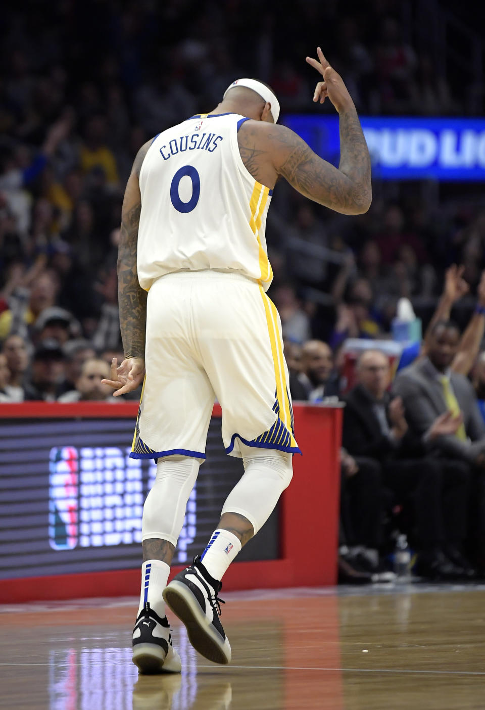 Golden State Warriors center DeMarcus Cousins gestures after scoring during the second half of the team's NBA basketball game against the Los Angeles Clippers on Friday, Jan. 18, 2019, in Los Angeles. The Warriors won 112-94. (AP Photo/Mark J. Terrill)