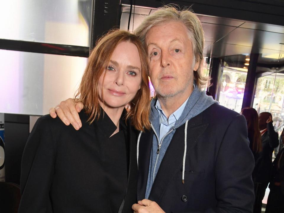 Stella McCartney and Sir Paul McCartney pose backstage at the Stella McCartney show during Paris Fashion Week Womenswear Spring/Summer 2023 at Centre Pompidou on October 3, 2022 in Paris, France