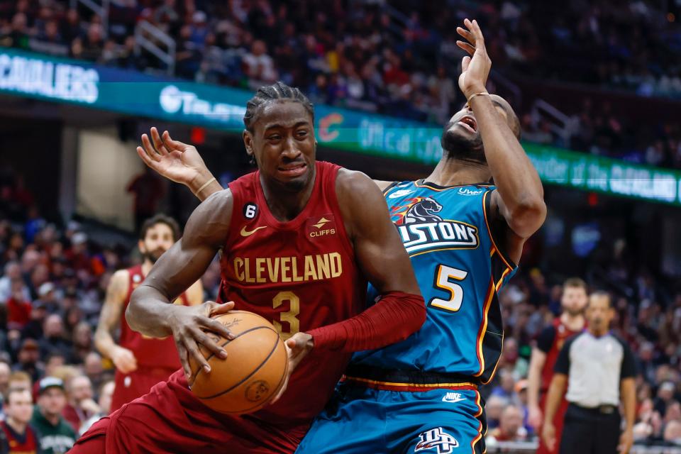 Cleveland Cavaliers guard Caris LeVert (3) drives against Detroit Pistons guard Alec Burks (5) during the second half of an NBA basketball game, Wednesday, Feb. 8, 2023, in Cleveland. (AP Photo/Ron Schwane)