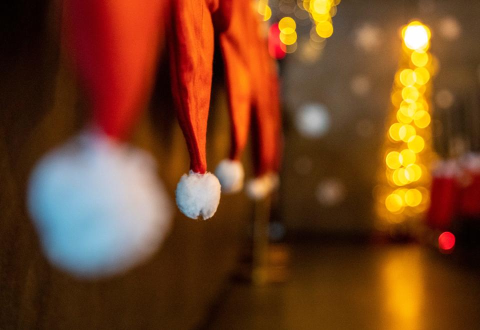 Santa hats are seen along the bar as a part of the holiday decorations that go with the Miracle pop-up bar collaboration at Truss & Twine in Palm Springs, Calif., Friday, Nov. 24, 2023.