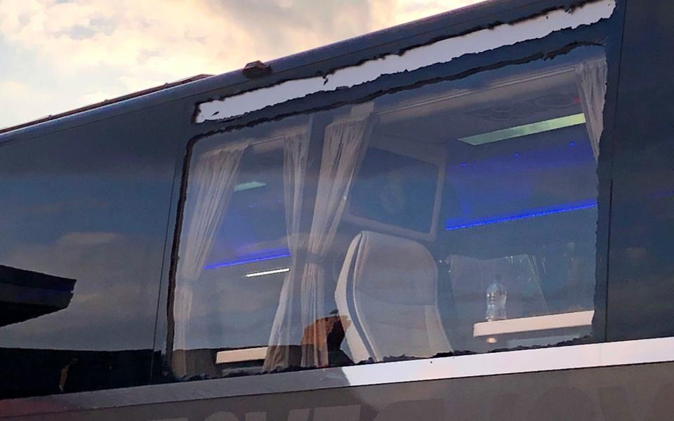 The Real Madrid team bus showing damage to a window after arriving at Anfield for the UEFA Champions League match against Liverpool - PA