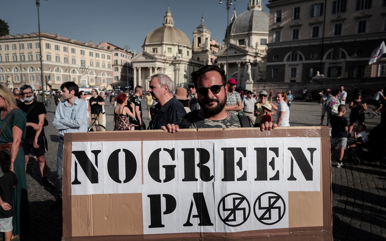 Demonstrators in Italy take part in a demonstration, organized by the No Vax and far-right movements against the "Green Pass", - Corbis/Corbis 