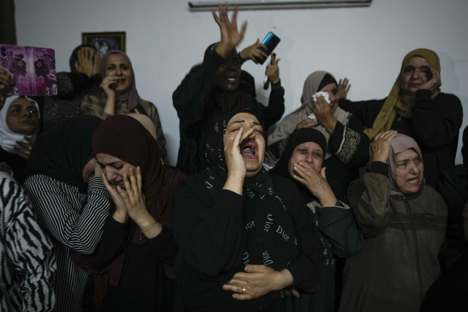 Family of Palestinian militant Samer El Shafei mourn in the Nur Shams refugee camp near the city of Tulkarem, in the occupied West Bank Saturday, May 6, 2023. Israeli forces shot dead two Palestinians during a military raid in the occupied West Bank Saturday, the Palestinian Health Ministry said, while a local armed group said the pair were militants.The ministry and Tulkarem's branch of Al Aqsa Martyrs Brigades, a militant group with connections to President Mahmoud Abbas' Fatah party, identified the pair as Samer El Shafei and Hamza Kharyoush, both aged 22 years. (AP Photo/Majdi Mohammed)