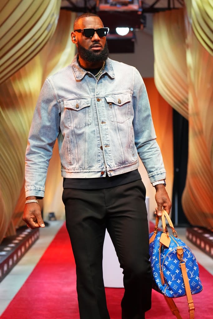 Revered athletes like LeBron James have been spotted with luxury bags, such at this Louis Vuitton duffel. NBAE via Getty Images