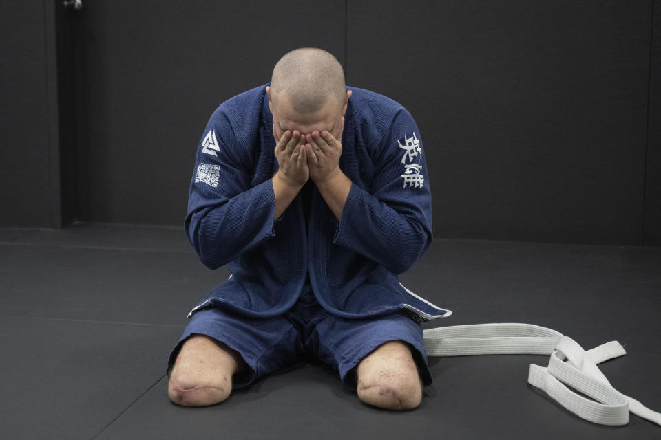 War veteran Vasyl Oksyntiuk, 26, reacts during a jiu jitsu training session in Kyiv, Ukraine, Tuesday, Oct. 3, 2023. More than 20,000 people in the Ukraine have lost limbs from injuries since the start of the Russian war, many of them soldiers. Some of them have learned to deal with their psychological trauma by practicing a form of Brazilian jiu-jitsu. (AP Photo/Efrem Lukatsky)