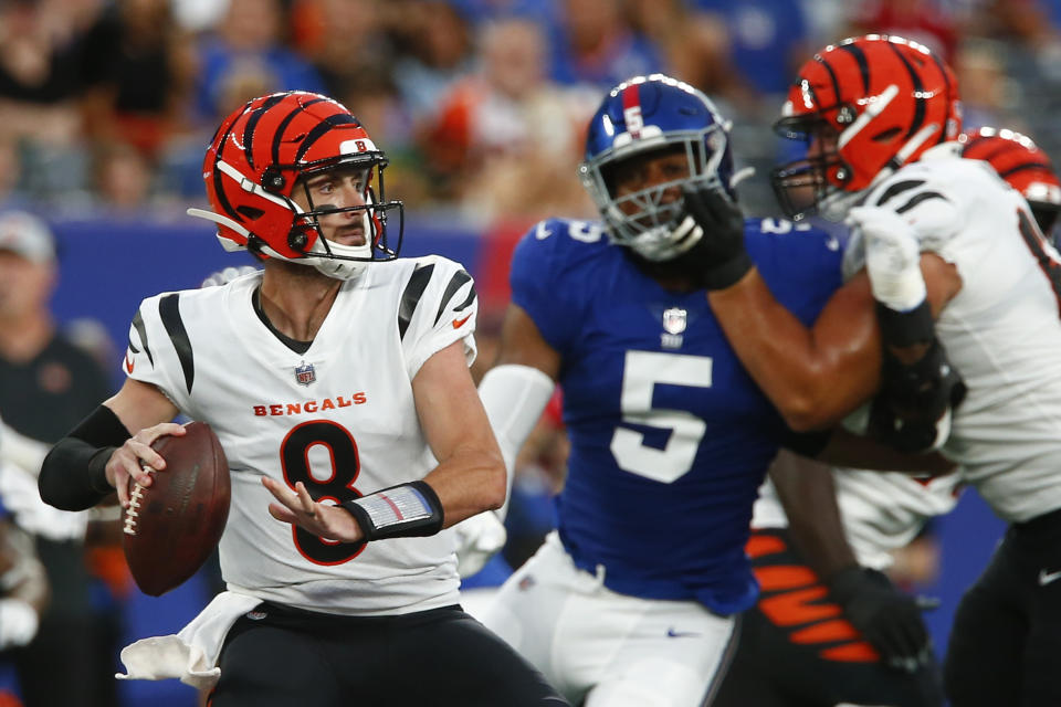 Cincinnati Bengals quarterback Brandon Allen (8) throws a pass as New York Giants' Kayvon Thibodeaux (5) rushes him during the first half of a preseason NFL football game Sunday, Aug. 21, 2022, in East Rutherford, N.J. (AP Photo/John Munson)