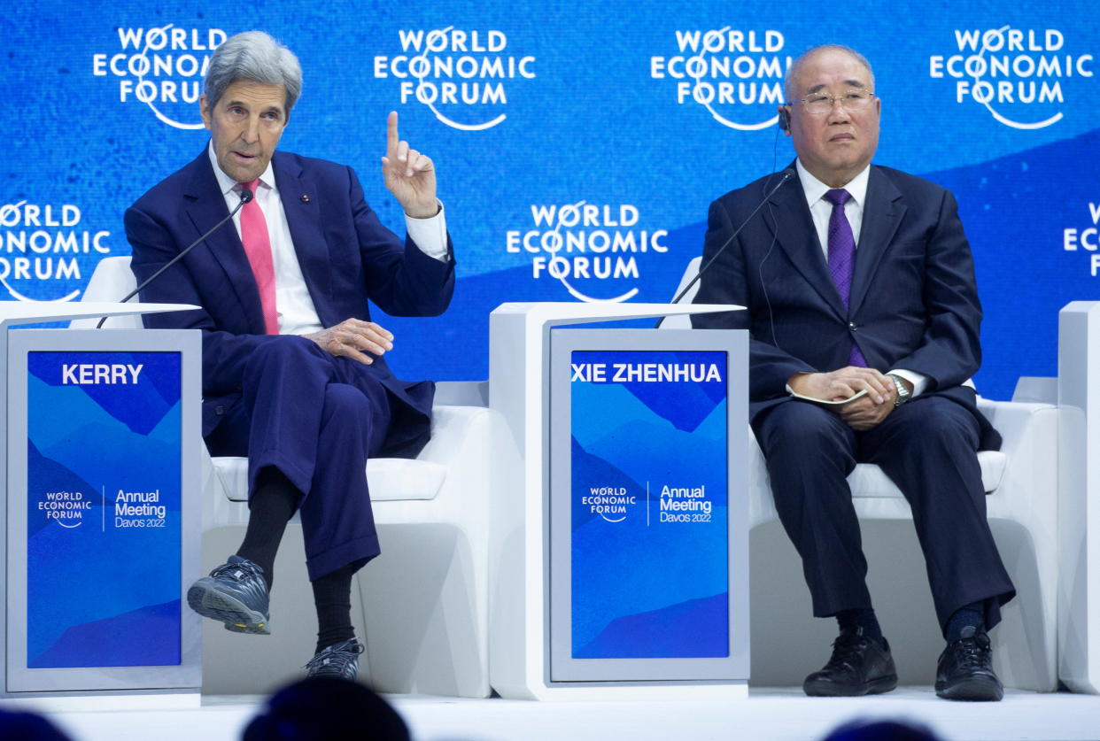 U.S. climate envoy John Kerry and China's chief climate negotiator Xie Zhenhua take part a panel discussion at the World Economic Forum 2022 (WEF) in the Alpine resort of Davos, Switzerland May 24, 2022.  REUTERS/Arnd Wiegmann