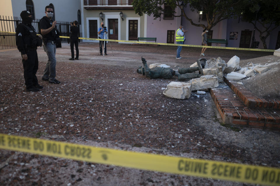 A statue of Spanish explorer Juan Ponce de León lays in pieces in Plaza San Jose in San Juan, Puerto Rico, Monday, Jan. 24, 2022. Unknown people toppled the in the pre-dawn hours of Monday ahead of a visit of King Felipe VI to the U.S. Caribbean territory of Puerto Rico. (AP Photo/Carlos Giusti)