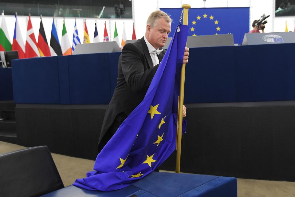 A bailiff carries a European flag on the eve of the inaugural session of the European Parliament following European elections on July 1, 2019, in the European Parliament in Strasbourg, eastern France. (Photo by FREDERICK FLORIN / AFP)        (Photo credit should read FREDERICK FLORIN/AFP/Getty Images)