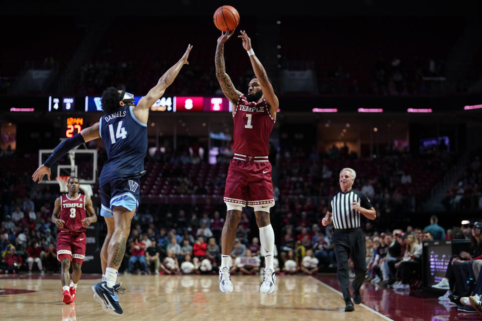 Temple's Damian Dunn, right, goes up for a shot against Villanova's Caleb Daniels during the first half of an NCAA college basketball game, Friday, Nov. 11, 2022, in Philadelphia. (AP Photo/Matt Slocum)