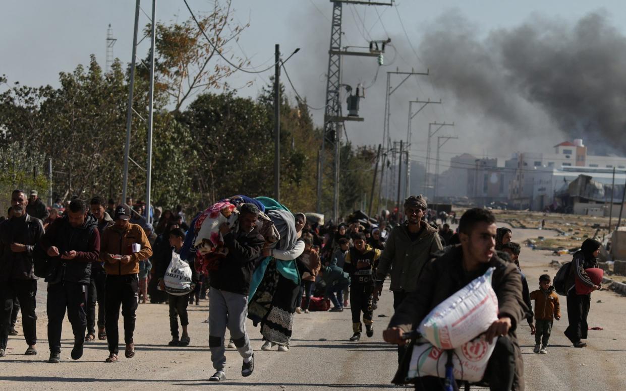 Palestinians fleeing Khan Younis for Rafah in southern Gaza amid fighting between Israel and the Palestinian group Hamas