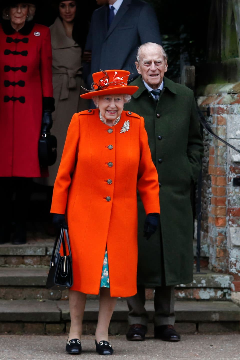 <p>The monarch and Prince Philip leave St Mary Magdalene Church in Sandringham on Christmas Day. It was one of the last times they were photographed attending the service together, as he passed away a few years later, in April 2021, at 99 years old. </p>