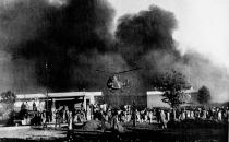 FILE - In this Nov. 21, 1979 file photo, a Pakistani army helicopter flies over the burning American Embassy building after it was attacked by anti-American demonstrators in Islamabad, Pakistan. This climatic event and others in 1979, which dominated television sets and newspaper front pages 40 years ago, helped shape the modern Middle East. (AP Photo, File)