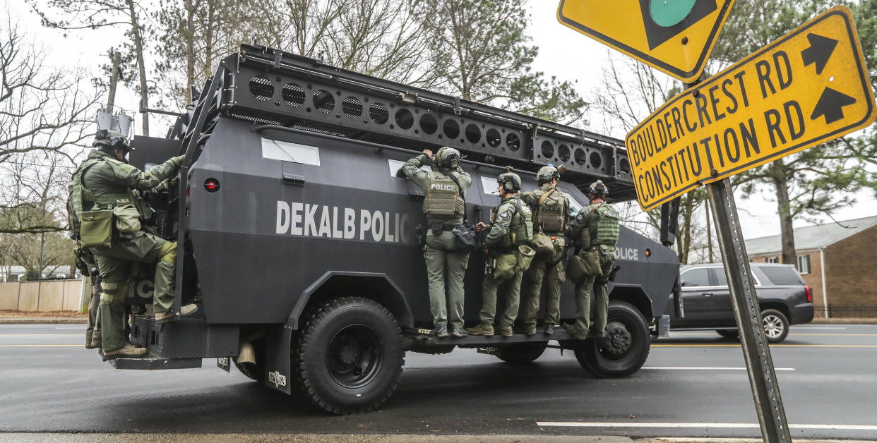 DeKalb, Ga., and Atlanta SWAT members leaving the Gresham Park command post in Atlanta, Jan. 18