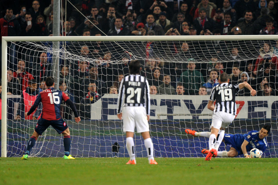 Juventus goalie Gianluigi Buffon saves a penalty by Genoa's Emanuele Calajo, during a Serie A soccer match between Genoa and Juventus, at Genoa's Luigi Ferraris Stadium, Italy, Sunday, March 16, 2014. (AP Photo/Tano Pecoraro)