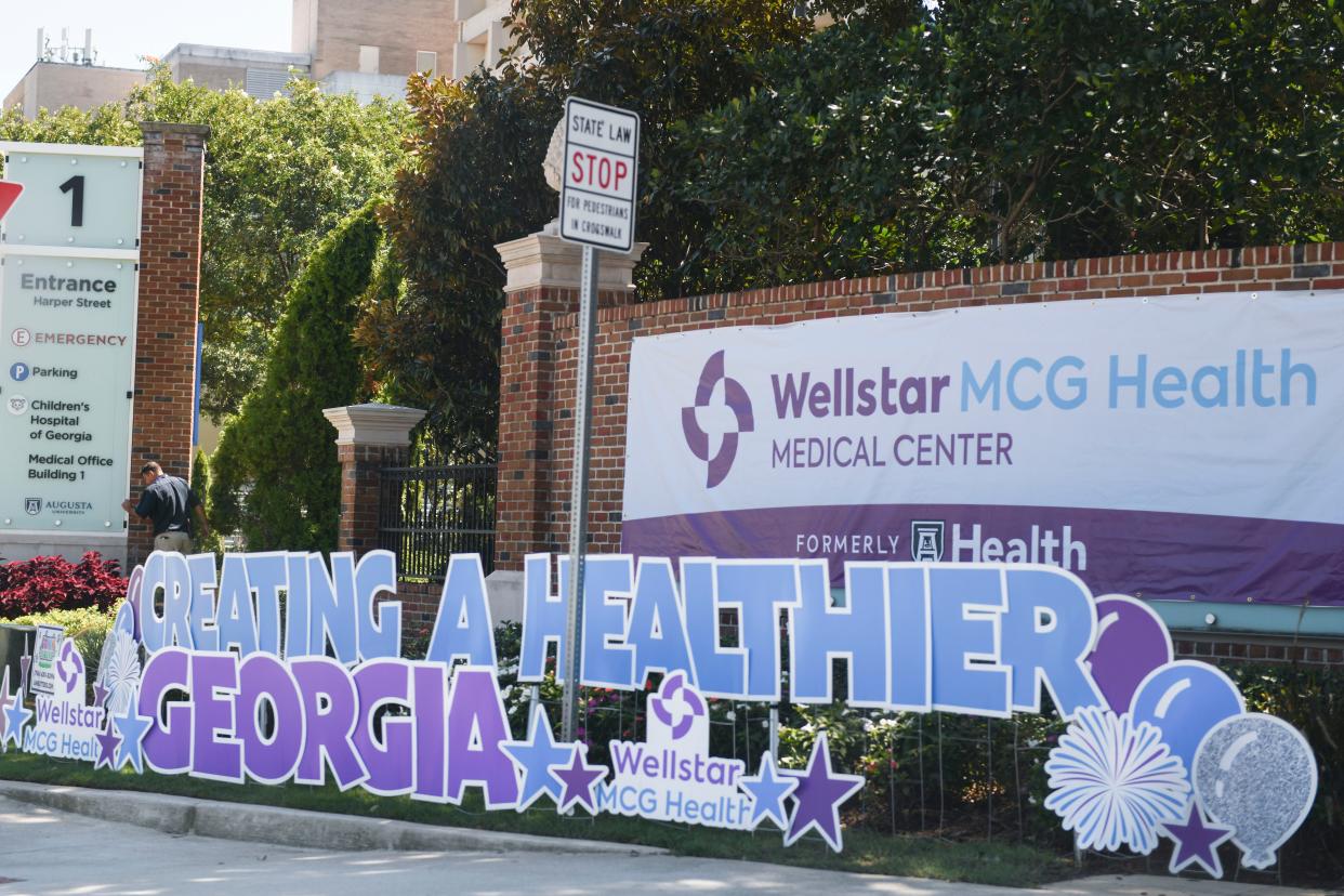 The new Wellstar MCG Health Medical Center banner hangs outside Augusta University on Thursday, Aug. 31, 2023.