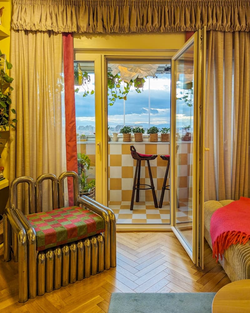 View from yellow living room into sunroom