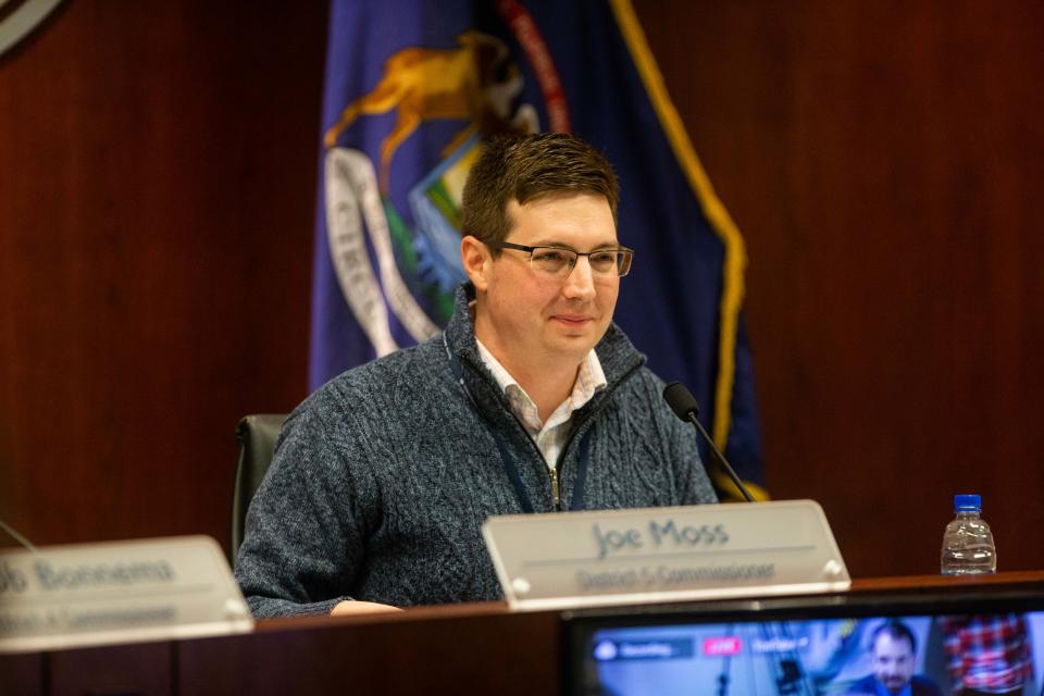 Board chairman Joe Moss smiles as he calls the meeting to order Tuesday, Feb. 28, 2023, at the Ottawa County Offices in West Olive.