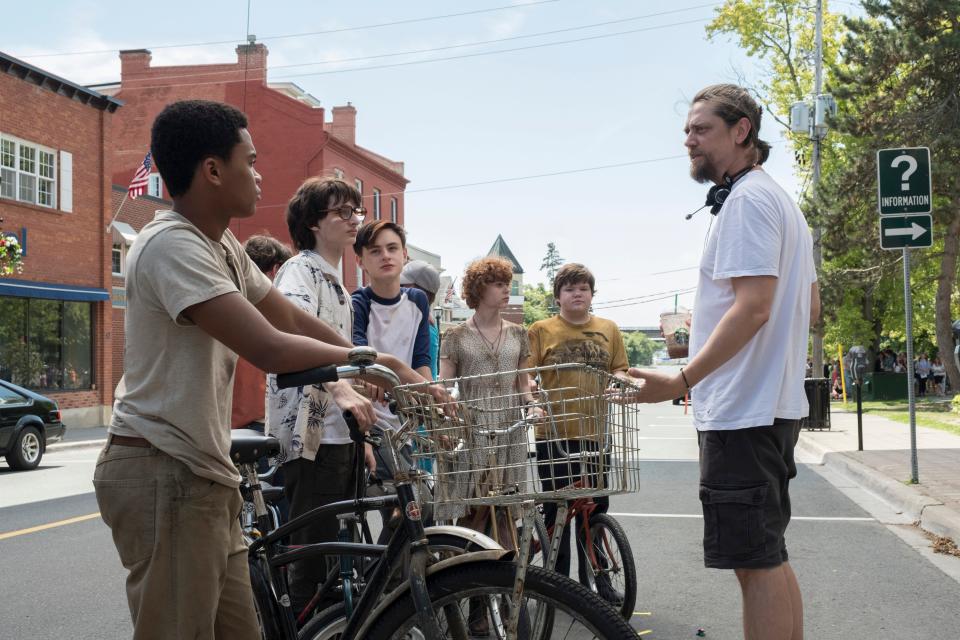 Director Andy Muschietti (right) works with young stars Chosen Jacobs, Finn Wolfhard, Jaeden Martell, Sophia Lillis and Jeremy Ray Taylor on the set of 