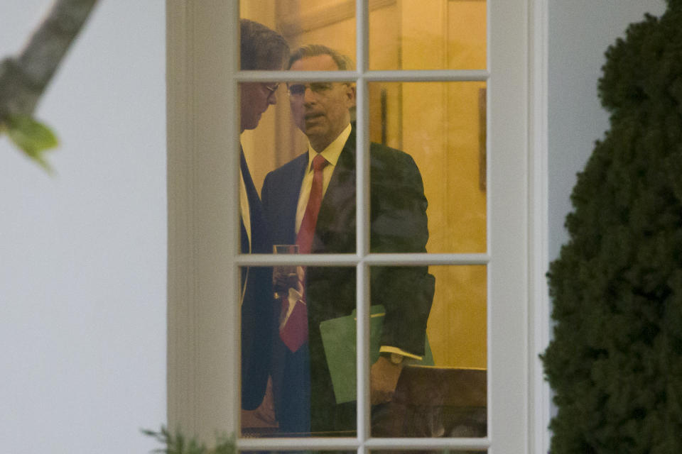 Attorney General William Barr, left, and White House Counsel Pat Cipollone, are seen during a meeting with President Donald Trump in the Oval Office of the White House, Thursday, Nov. 14, 2019, in Washington. (AP Photo/Alex Brandon)