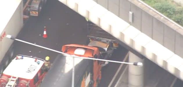 Driver escapes car jammed between two trucks. Photo: 7News