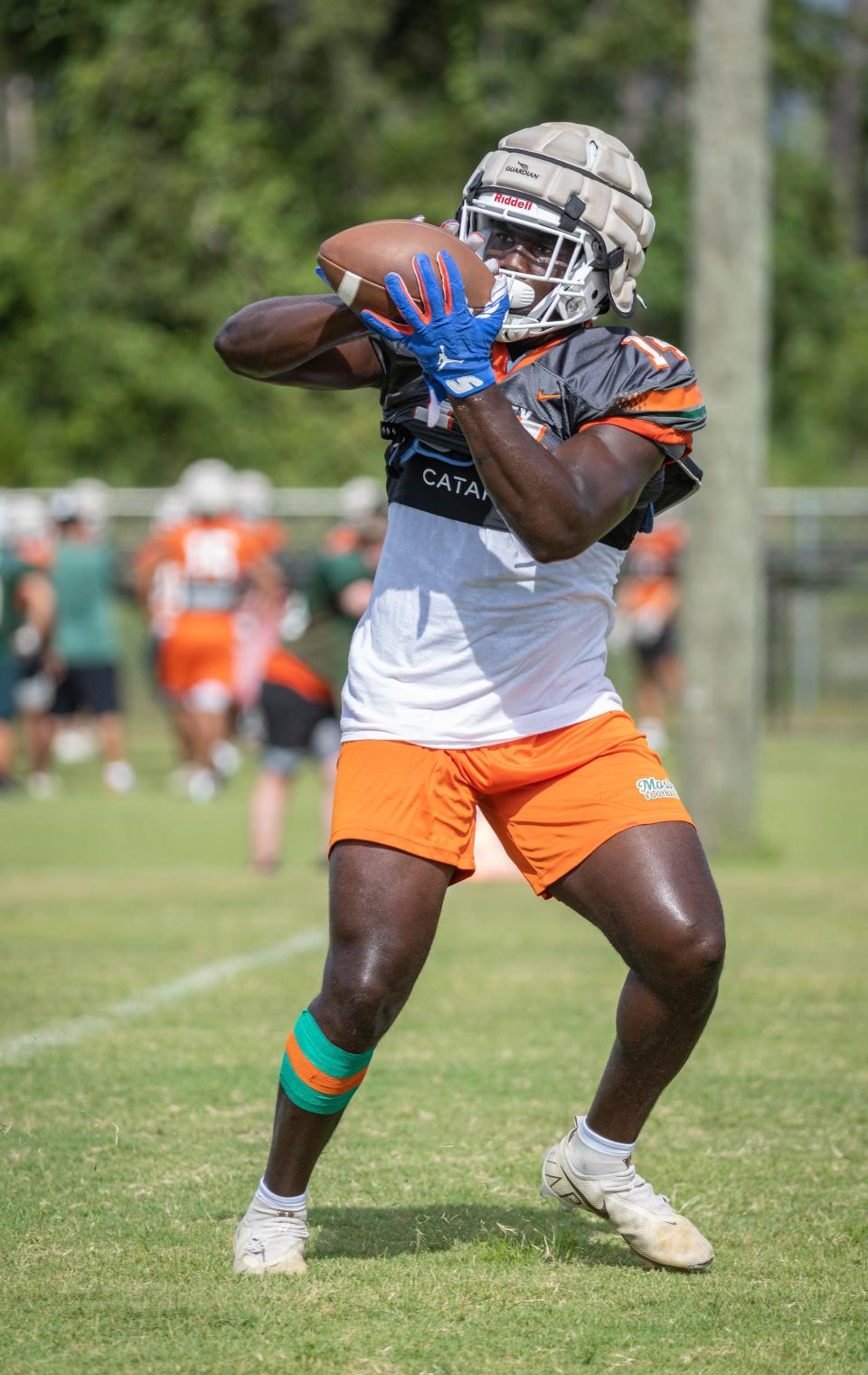 Mosley High School hit the practice field getting prepared for the upcoming season. Senior Randy Pittman pulls in a pass during practice Friday, August 5, 2022.