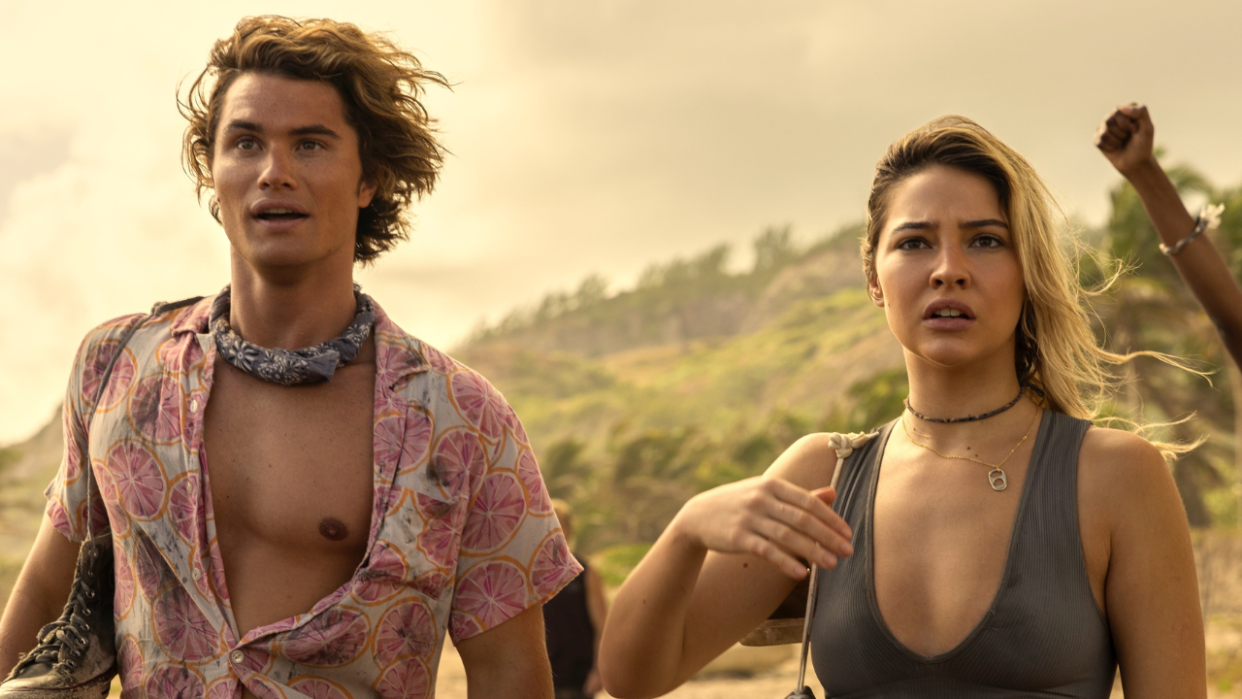  Chase Stokes and Madelyn Cline standing on an island in Season 3 of Outer Banks 