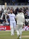 England's Jonny Bairstow raises his bat to celebrate their win on the fifth day of the third cricket test match against New Zealand at Headingley in Leeds, England, Monday, June 27, 2022. (AP Photo/Rui Vieira)