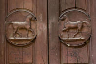 A detail of a door is seen at the Cavallerizza Reale building, which is occupied by the "Assemblea Cavallerizza 14:45" movement in Turin, Italy, July 20, 2016. REUTERS/Marco Bello