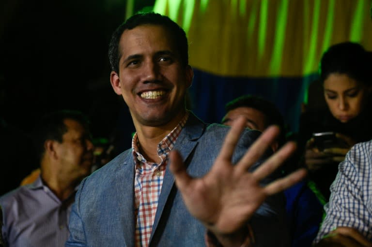 National Assembly speaker Juan Guaido waves to supporters January 16, 2019