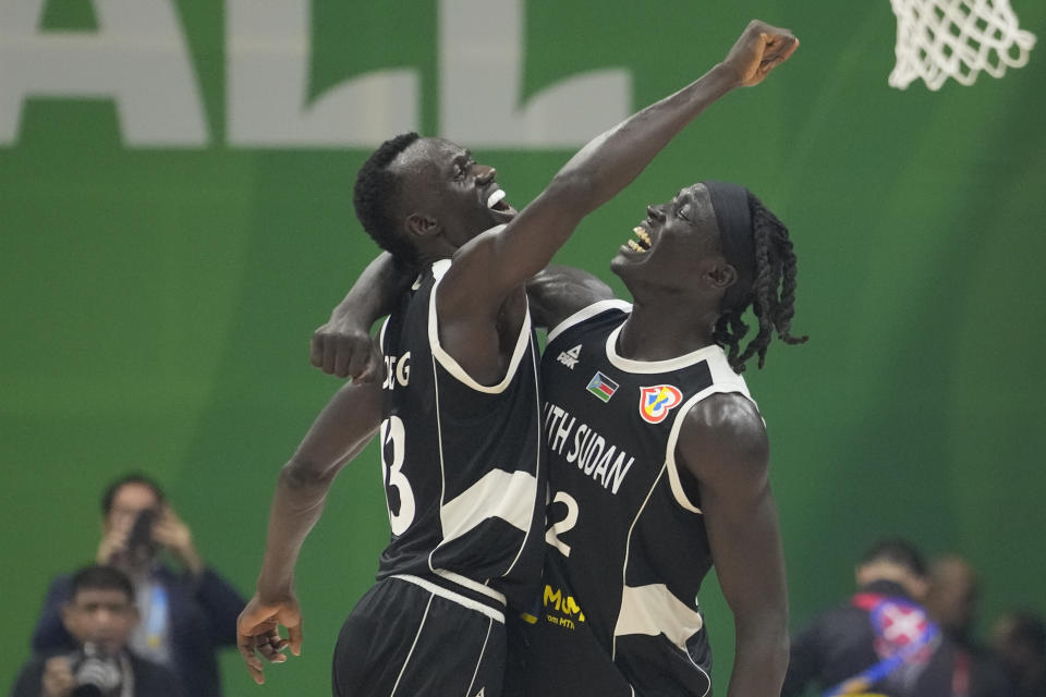 South Sudan team celebrates after winning against Angola during their Basketball World Cup classification match at the Araneta Coliseum, Manila, Philippines on Saturday Sept. 2, 2023. (AP Photo/Aaron Favila)