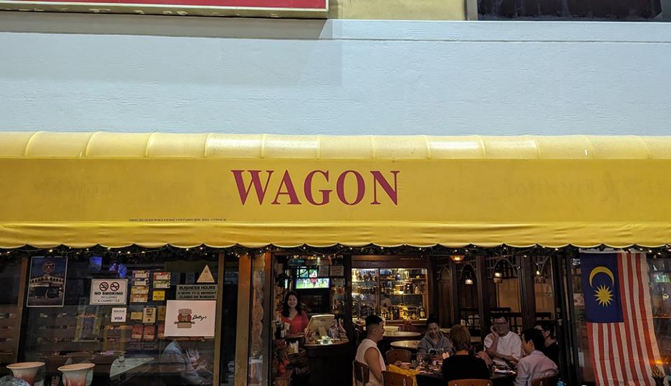 You can’t miss the bright yellow mini-canopy by the front of Wagon Bar.