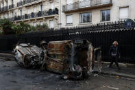 Vandalized cars are seen on Avenue Foch the morning after clashes with protesters wearing yellow vests, a symbol of a French drivers' protest against higher diesel taxes, in Paris, France, December 2, 2018. REUTERS/Benoit Tessier