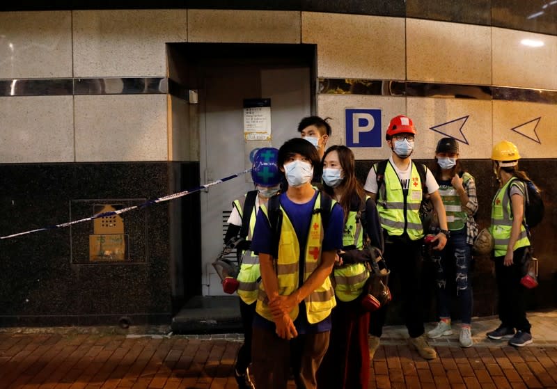 Medical volunteers leave Hong Kong Polytechnic University (PolyU) campus, in Hong Kong